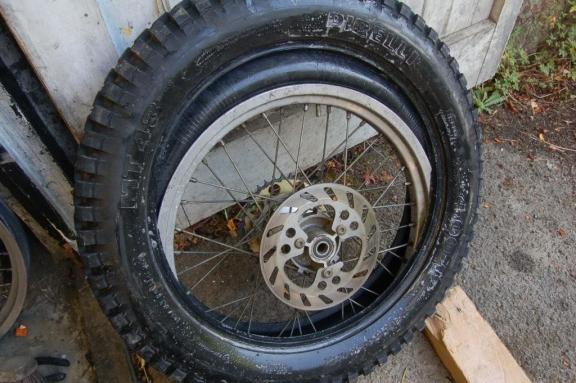 Once both sides of the tyre are free from the rim the rim and tyre will drop down into the tyre.